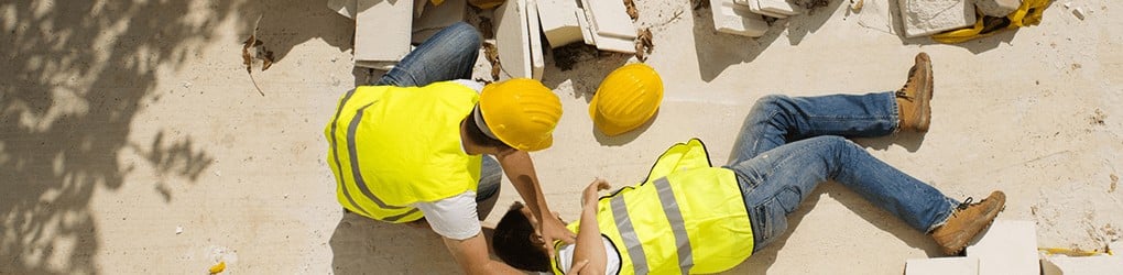 man laying on the ground after a construction accident