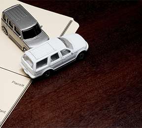 2 car figurines in a collision