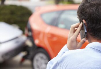 driver on the phone with the barnes firm after being hit in a car accident