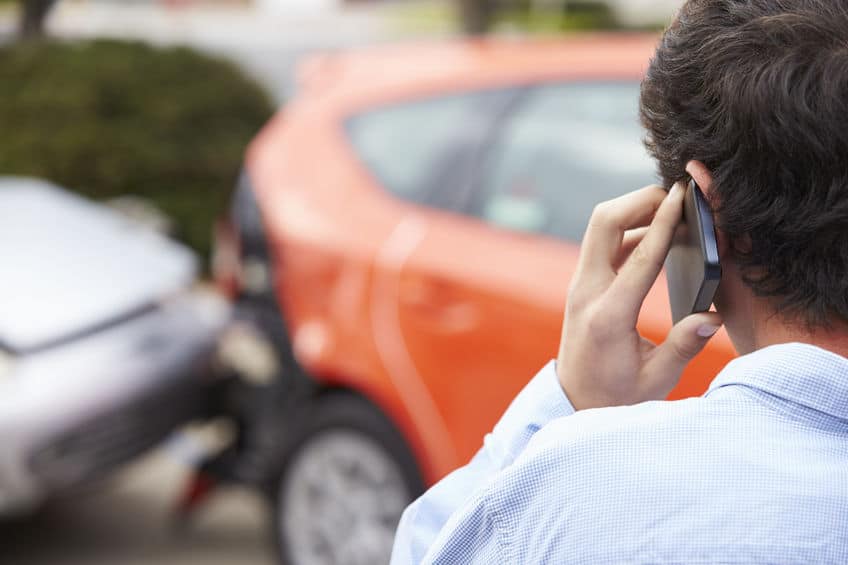 driver on the phone with the barnes firm after being hit in a car accident
