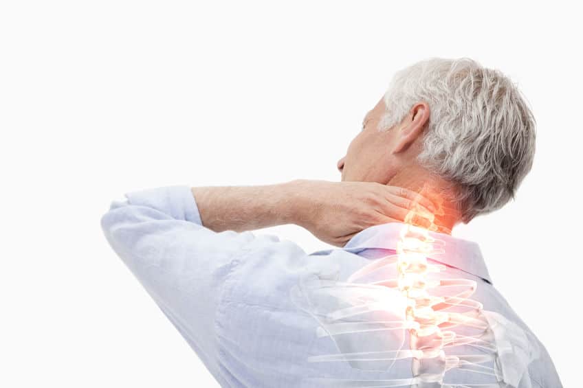 man holding the back of his neck with his spine highlighted