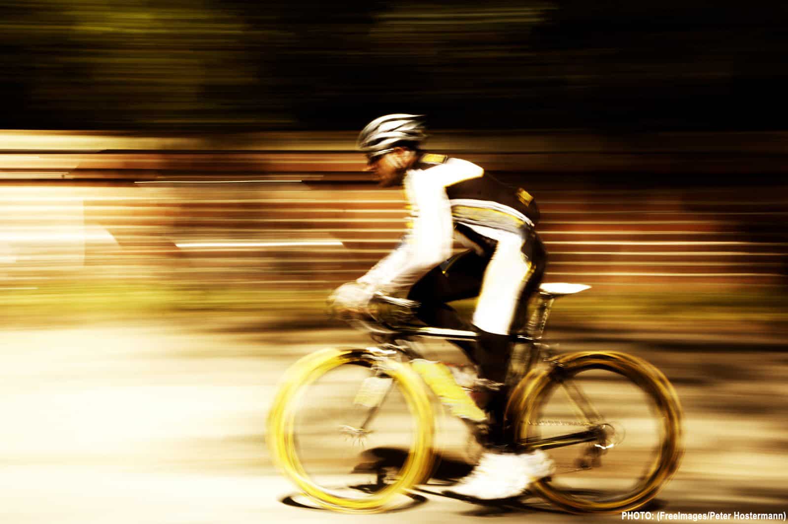 cyclist riding a bike with a blurred background