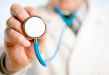 doctor holding a stethoscope out