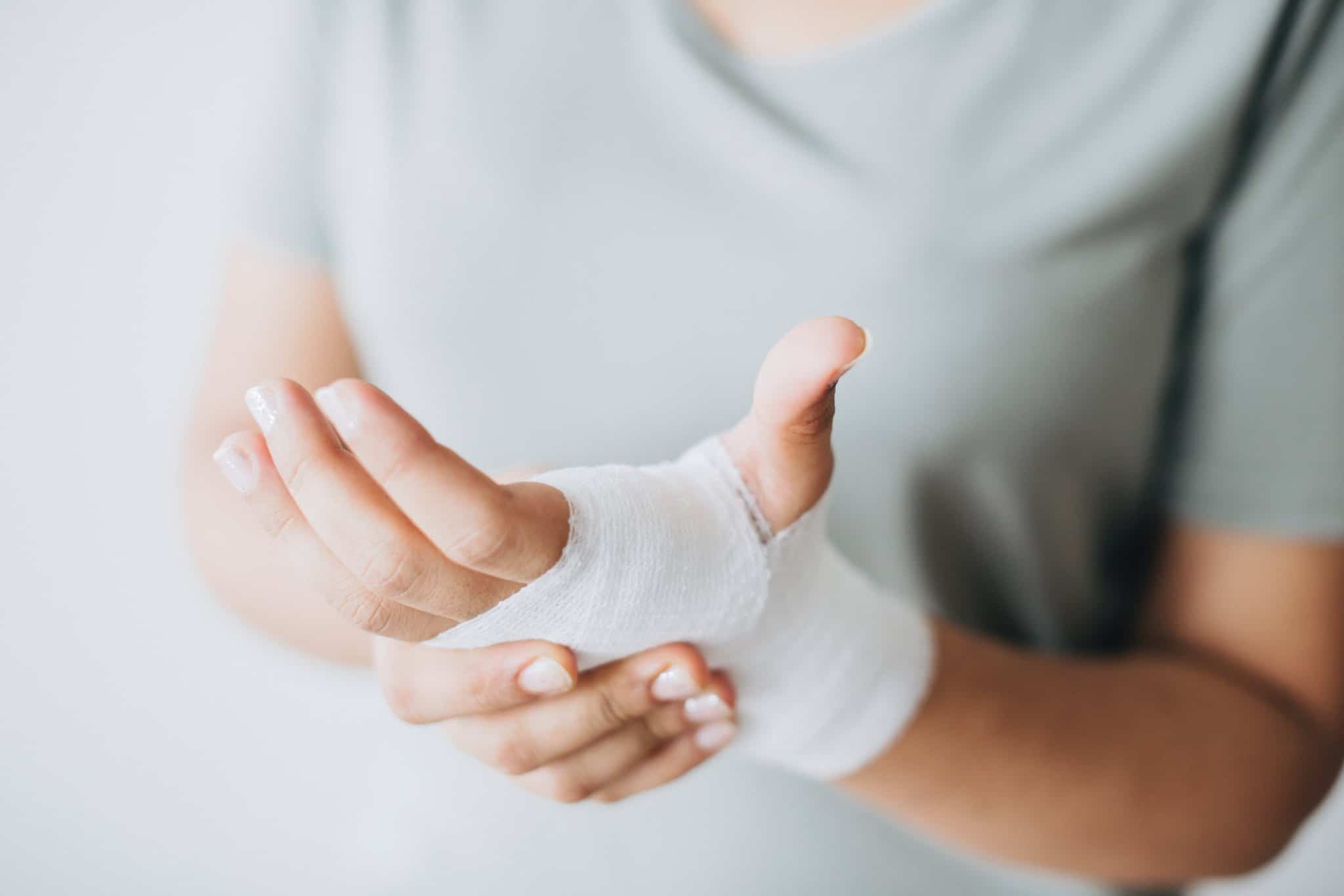 person holding their bandaged hand