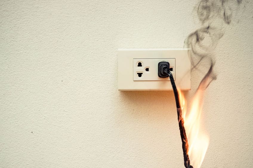 on fire cord plugged into outlet