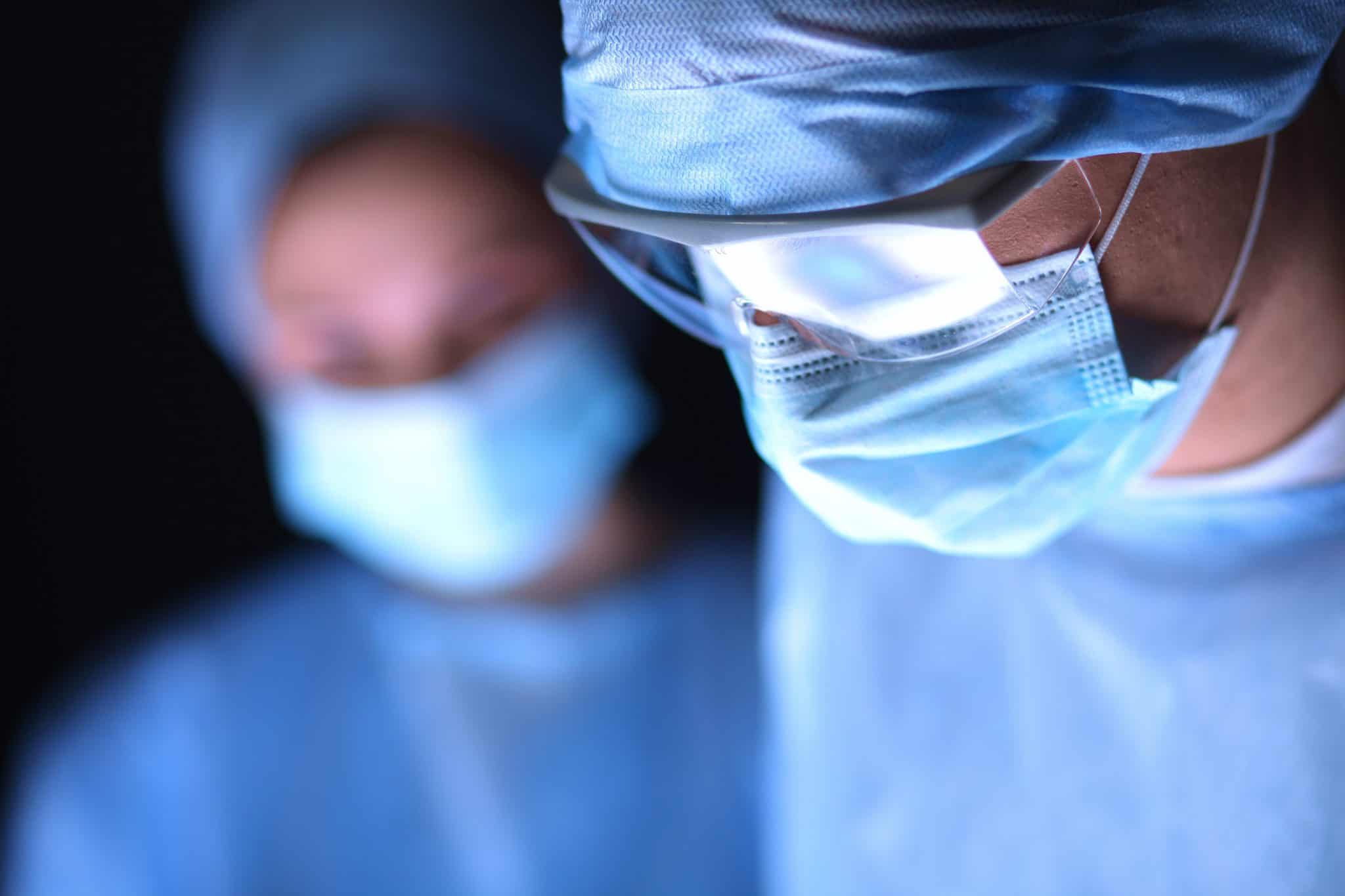 surgeons working in an operating room