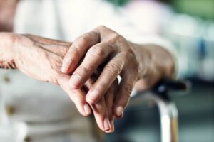 Close up hands of senior elderly woman