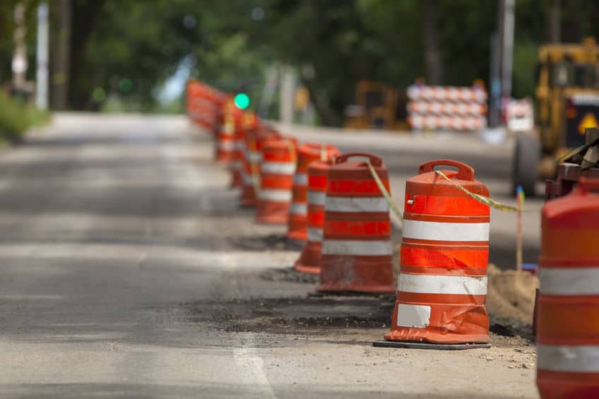 Construction zone with orange caution barrels