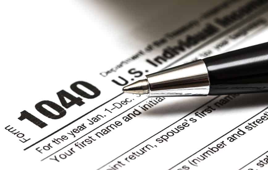 US 1040 tax form with pen