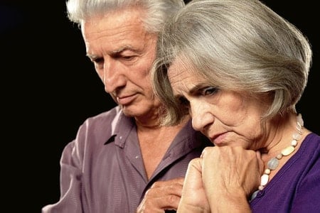 sad elderly couple