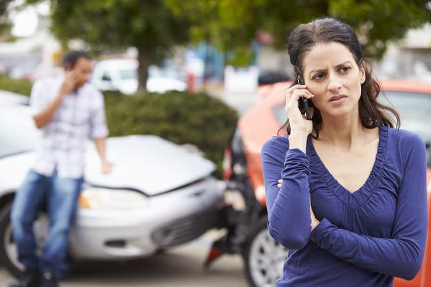 driver making a phone call after being rear ended in a car accident