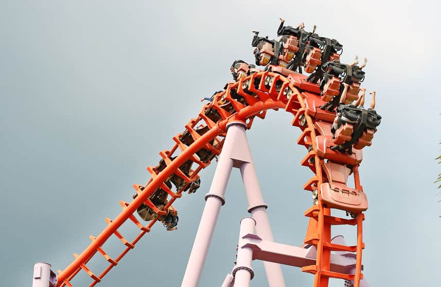people riding an orange roller coaster; lawyers for injuries after roller coaster accidents
