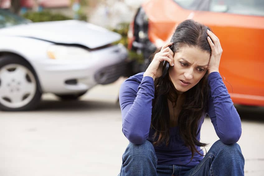 Female Driver Making Phone Call After Traffic Accident and rearending