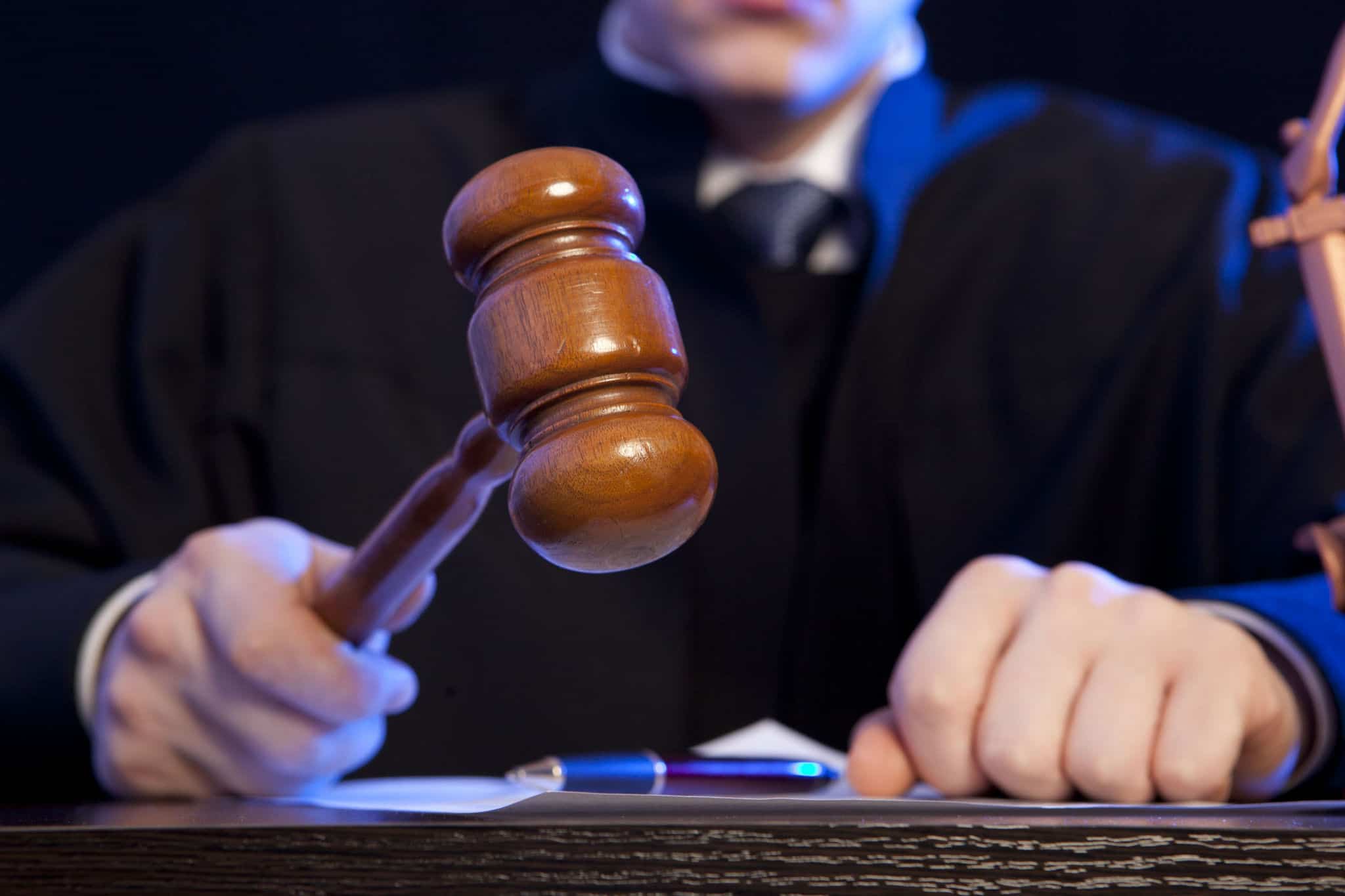 judge using a gavel in a courtroom