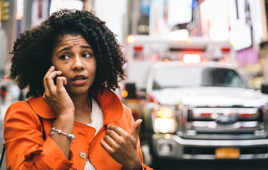 woman calling car accident lawyers in new york city after a bike accident