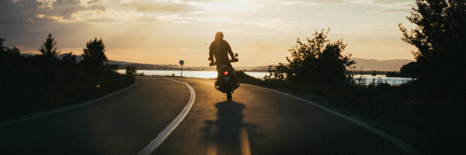 motorcyclist riding on road