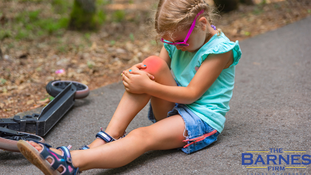 Image of a Girl with Injured Knee Fell from Scooter on the Road