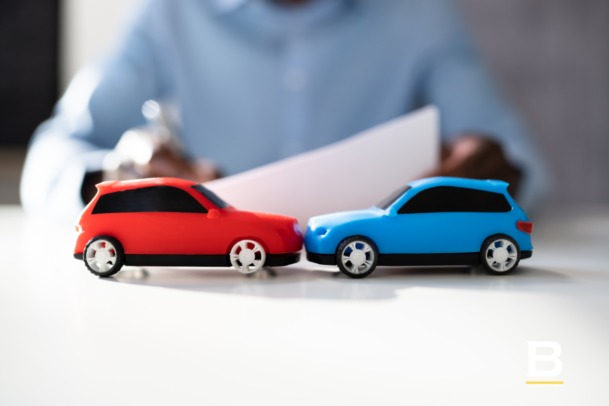 Two cars in front of a lawyer