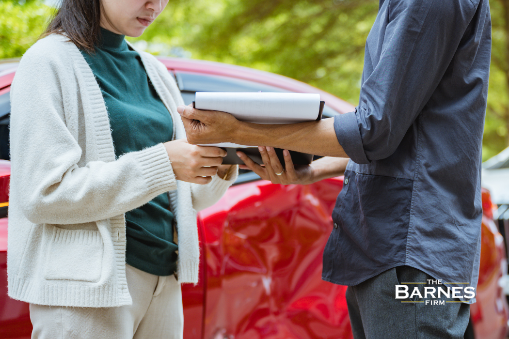 insurance adjustor presenting offer to client at a rochester car accident scene