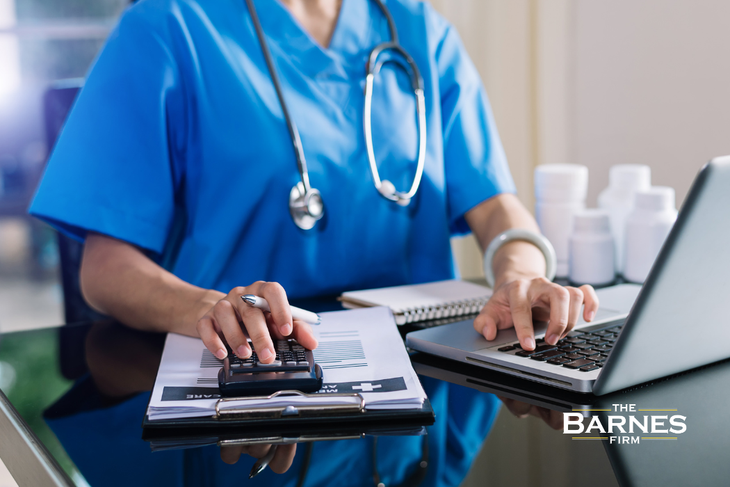 doctor calculating a patients medical bills